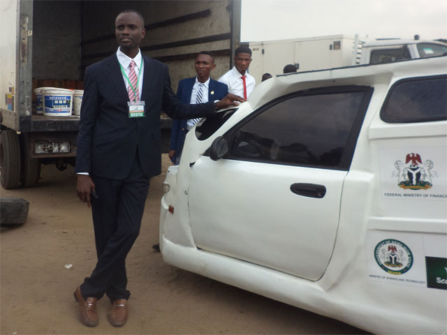 Eniang Nkereuwem Archibong of Enelec GS Nigeria standing by his solar powered vehicle