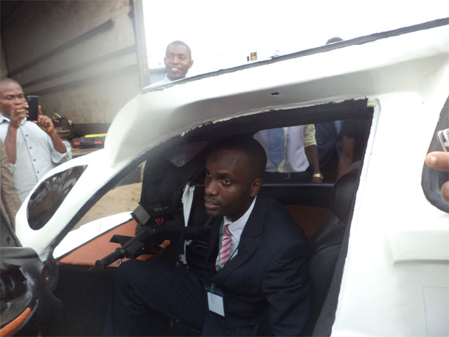 Eniang Nkereuwem Archibong of Enelec GS Nigeria sitting in his solar powered vehicle